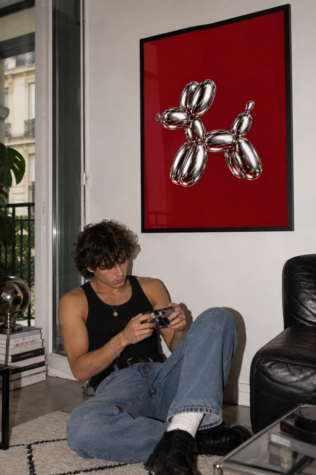 Full of Hot Air — chrome balloon dog poster on burgundy in a black frame in a living room by WallDrip